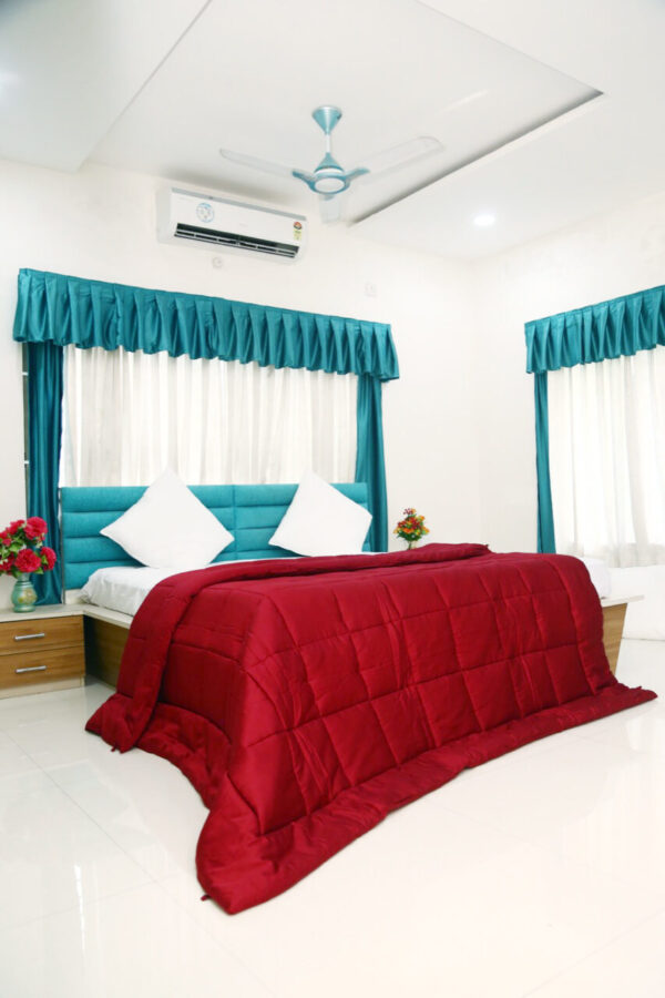 Red Comforter In Room